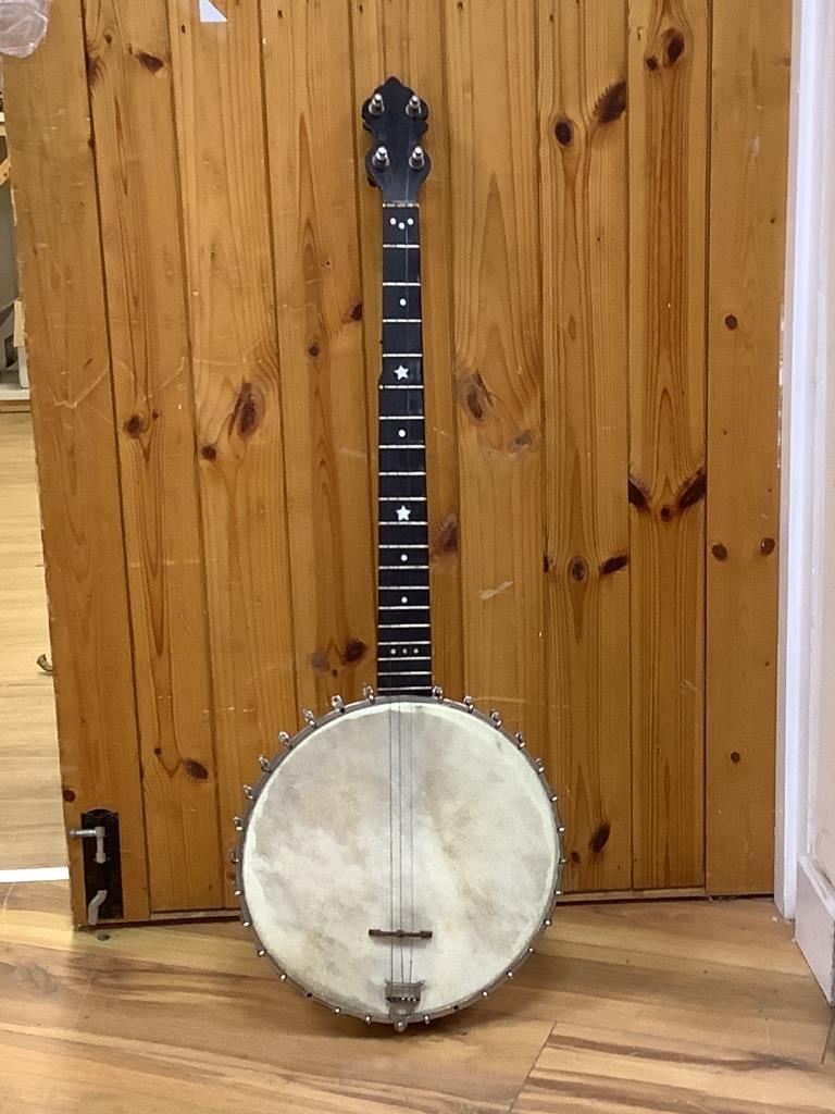 A cased banjo, unmarked